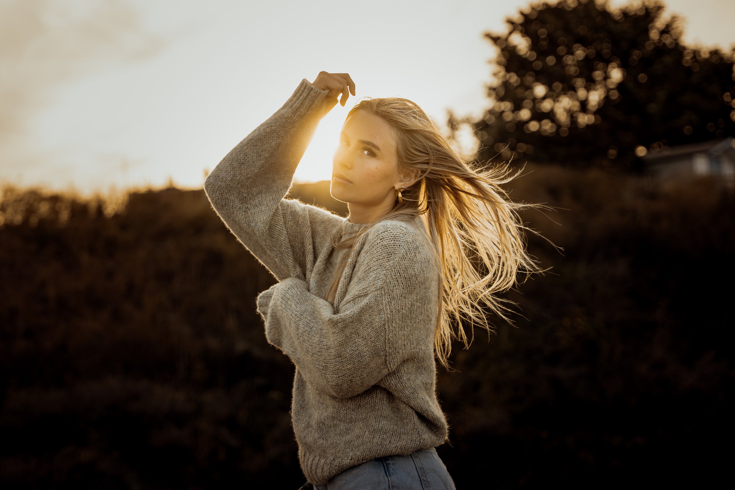 Golden hour portrait with wind in the hair